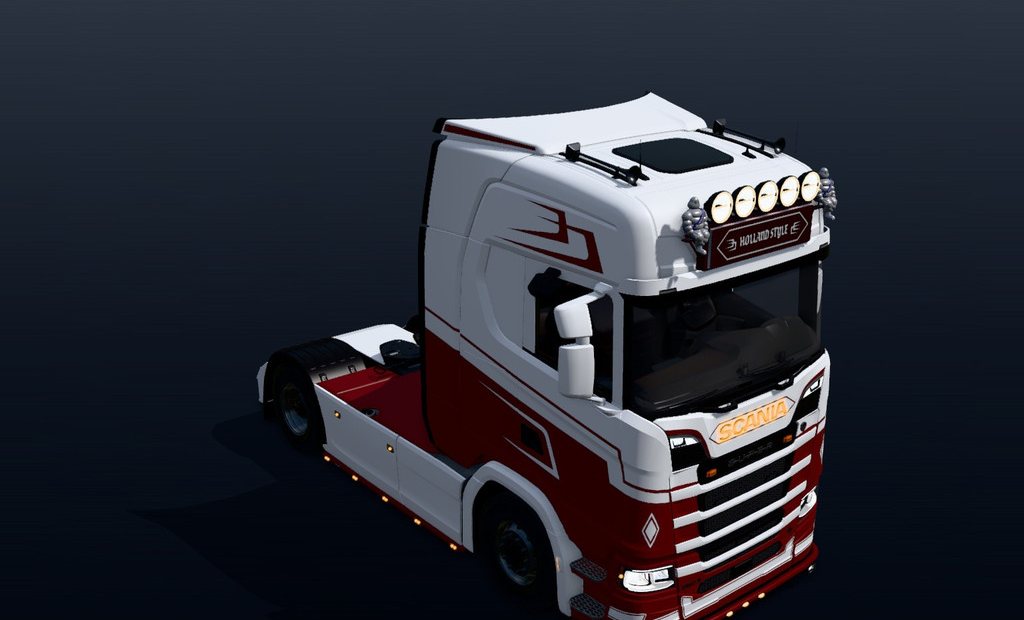 A white and red Scania in daylight